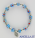 Bracciale elastico imitazione murrina azzurro e medaglia miracolosa