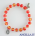 Bracciale elastico perle vetro bicolore rosso/giallo e medaglia miracolosa