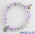 Bracciale elastico perle vetro bicolore verde/viola e medaglia miracolosa